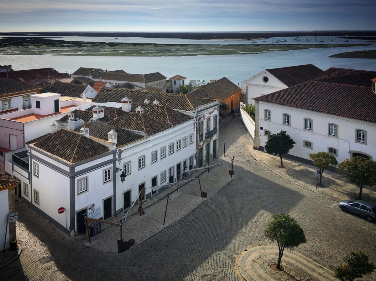 scenic view of taviras historic buildings near the river under a clear sky | Two Scots Abroad Scenic view of Tavira's historic buildings near the river under a clear sky.