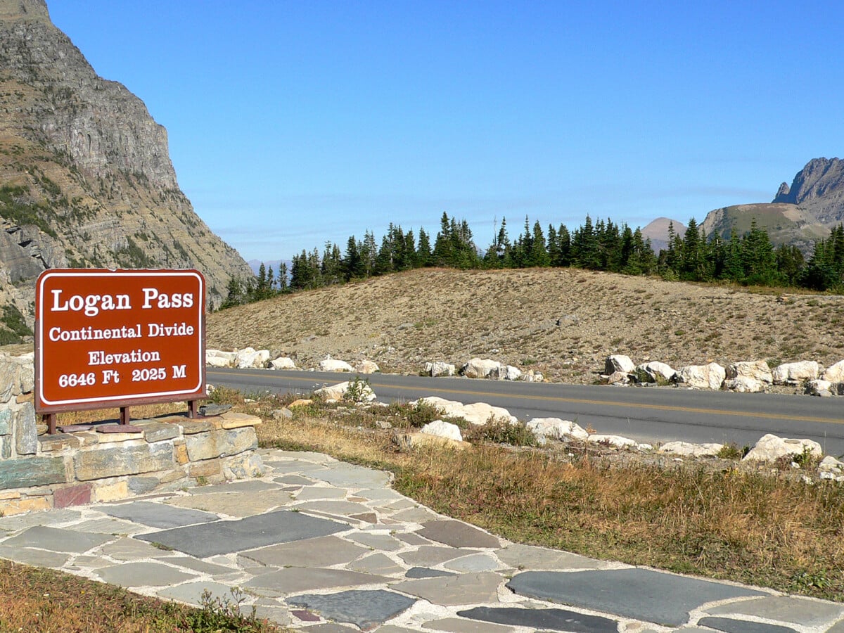 should you add the grinnell glacier overlook | Two Scots Abroad The Logan Pass Continental Divide sign beside Going-to-the-Sun Road