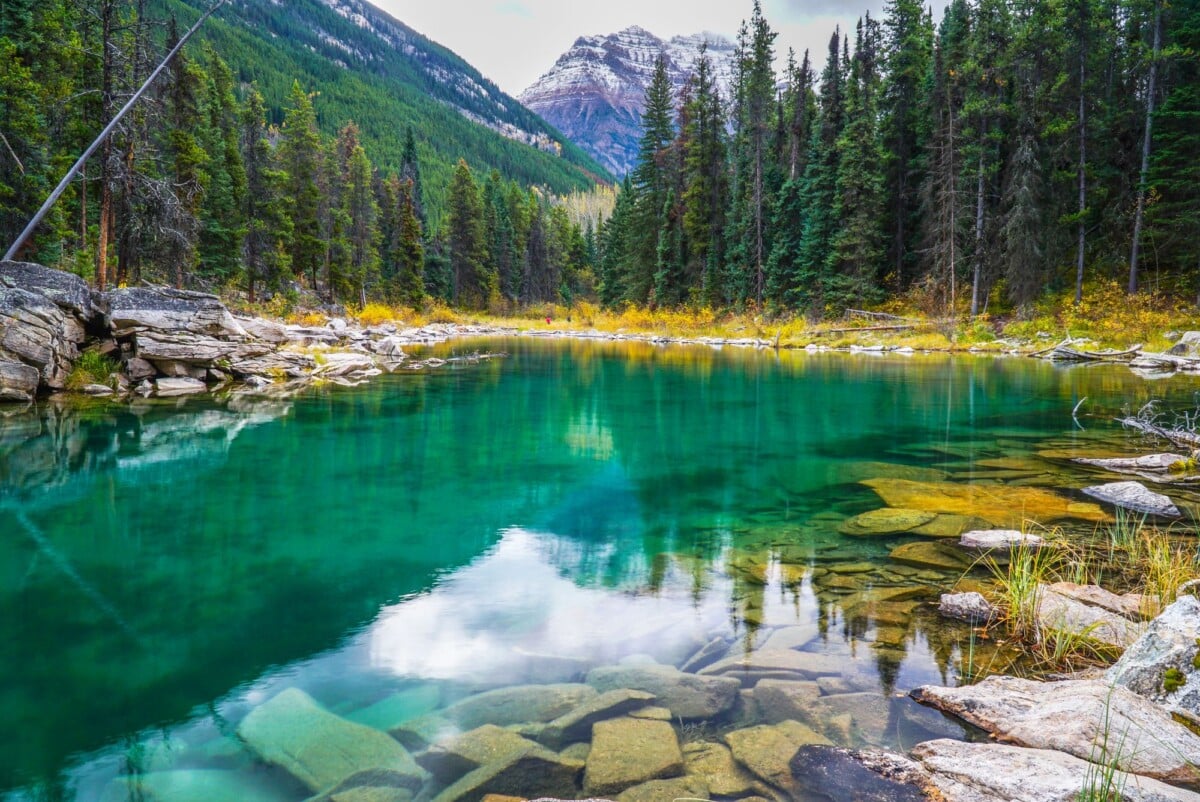 stunning view of horseshoe lake with emerald waters and mountain reflection in j | Two Scots Abroad Stunning view of Horseshoe Lake with emerald waters and mountain reflection in Jasper National Park.