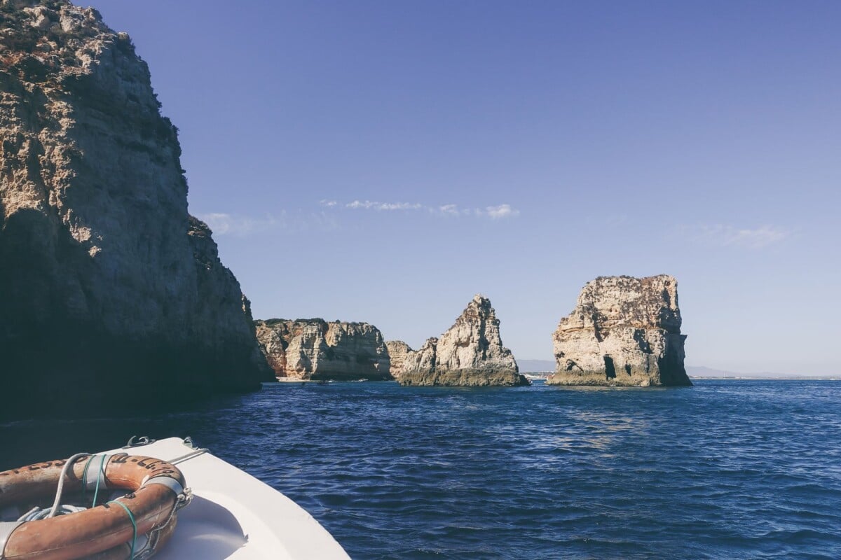 tranquil scene of algarve cliffs and ocean from a boat ideal for travel and vaca | Two Scots Abroad Tranquil scene of Algarve cliffs and ocean from a boat, ideal for travel and vacation themes.