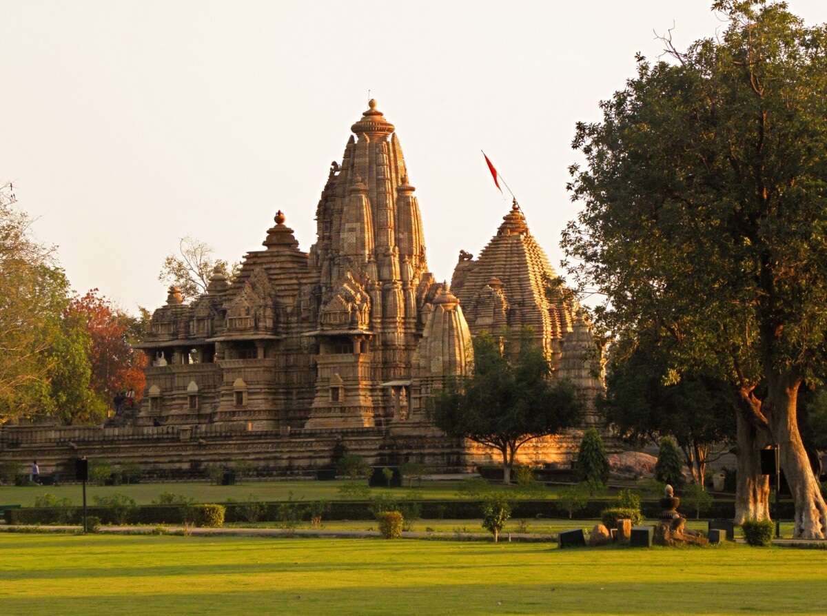 view of the historic khajuraho temples in madhya pradesh during sunset highlight | Two Scots Abroad View of the historic Khajuraho Temples in Madhya Pradesh during sunset, highlighting ancient architecture.
